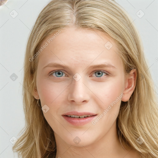 Joyful white young-adult female with long  brown hair and blue eyes