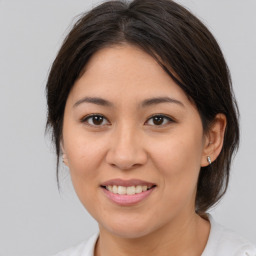 Joyful white young-adult female with medium  brown hair and brown eyes