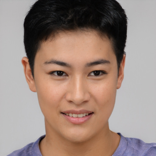 Joyful asian young-adult female with short  black hair and brown eyes