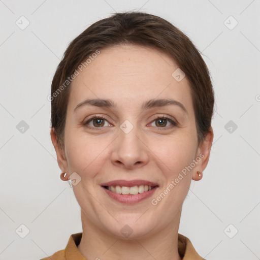 Joyful white young-adult female with short  brown hair and grey eyes