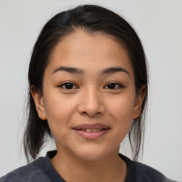 Joyful asian young-adult female with medium  brown hair and brown eyes