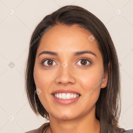 Joyful white young-adult female with long  brown hair and brown eyes