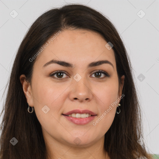 Joyful white young-adult female with long  brown hair and brown eyes