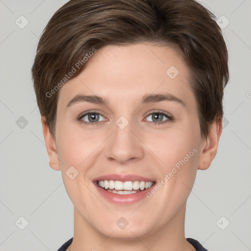 Joyful white young-adult female with short  brown hair and grey eyes