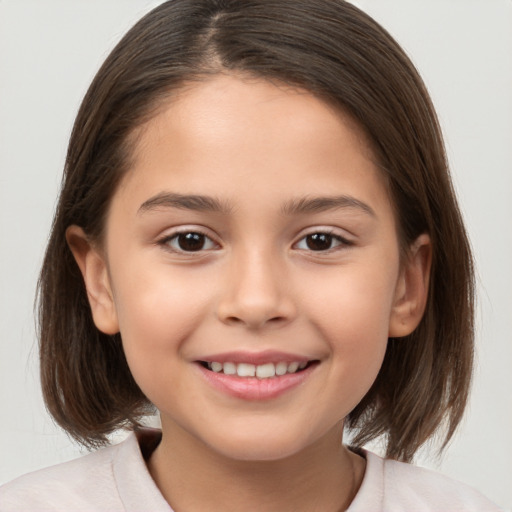 Joyful white child female with medium  brown hair and brown eyes