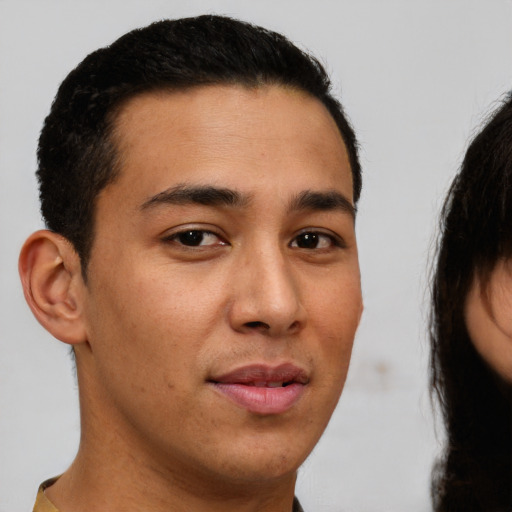 Neutral latino young-adult male with short  brown hair and brown eyes