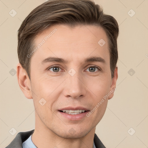 Joyful white young-adult male with short  brown hair and grey eyes