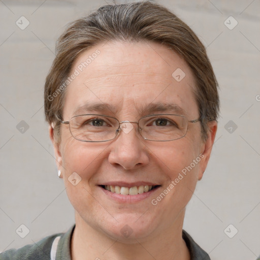 Joyful white adult female with short  brown hair and grey eyes