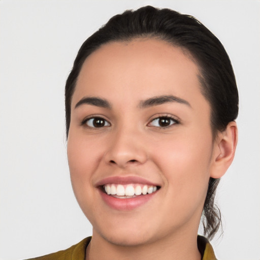 Joyful white young-adult female with long  black hair and brown eyes