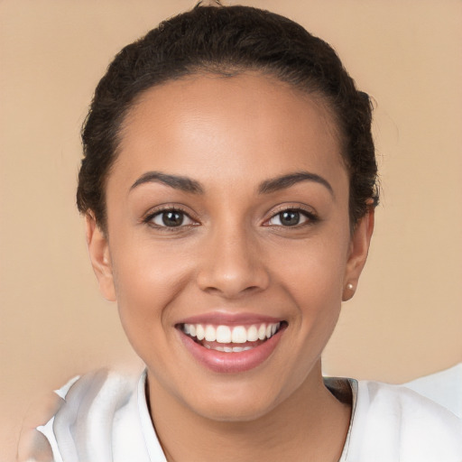 Joyful white young-adult female with short  brown hair and brown eyes