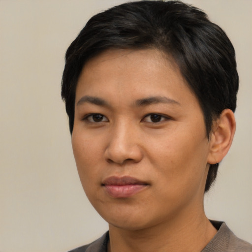 Joyful asian young-adult female with short  black hair and brown eyes