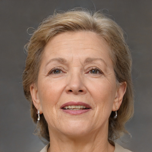 Joyful white middle-aged female with medium  brown hair and brown eyes