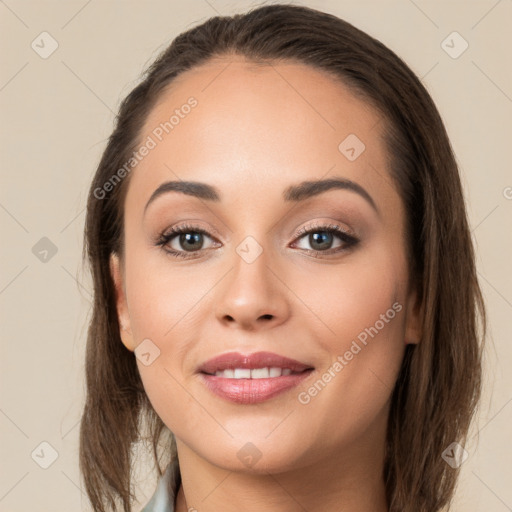 Joyful white young-adult female with long  brown hair and brown eyes