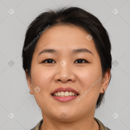 Joyful asian young-adult female with medium  brown hair and brown eyes