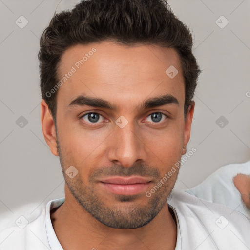 Joyful white young-adult male with short  brown hair and brown eyes