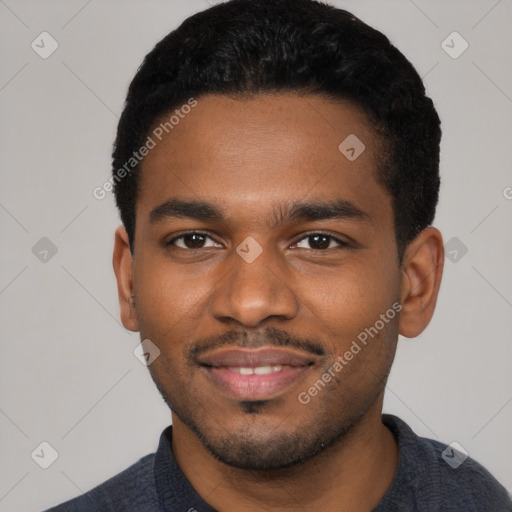 Joyful black young-adult male with short  black hair and brown eyes