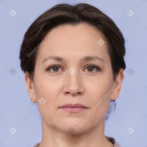 Joyful white adult female with short  brown hair and brown eyes