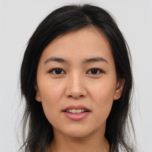 Joyful asian young-adult female with medium  brown hair and brown eyes