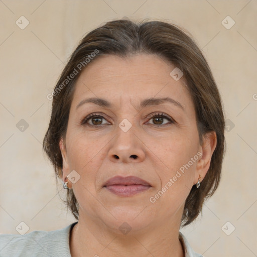 Joyful white adult female with medium  brown hair and brown eyes