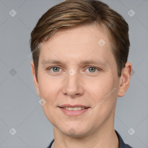 Joyful white adult male with short  brown hair and grey eyes