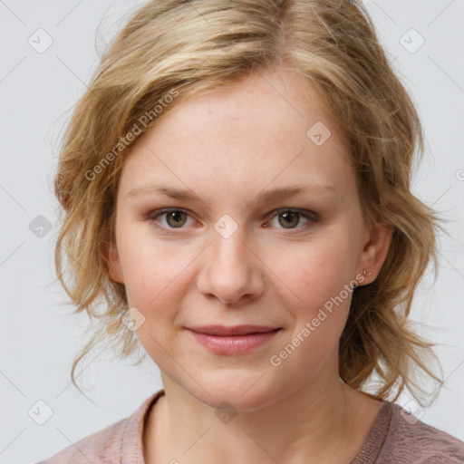 Joyful white young-adult female with medium  brown hair and blue eyes