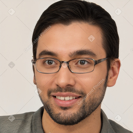 Joyful white young-adult male with short  brown hair and brown eyes