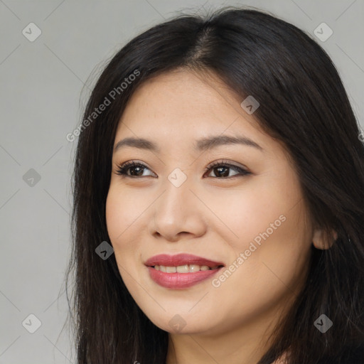 Joyful latino young-adult female with long  brown hair and brown eyes