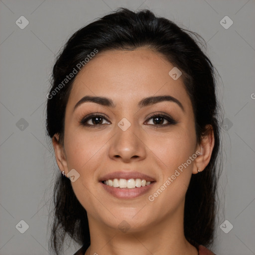 Joyful latino young-adult female with medium  brown hair and brown eyes