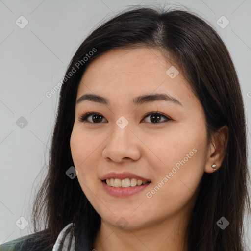 Joyful white young-adult female with long  brown hair and brown eyes