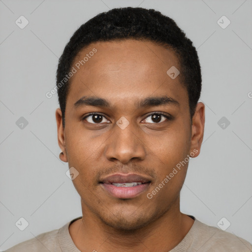 Joyful black young-adult male with short  black hair and brown eyes