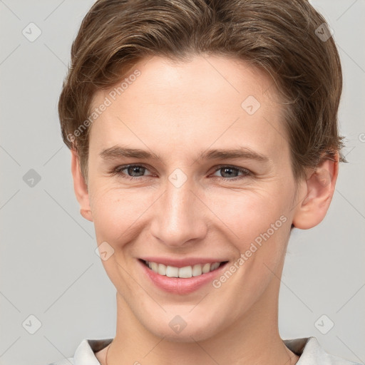 Joyful white young-adult female with short  brown hair and grey eyes