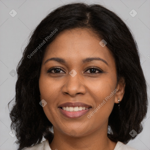 Joyful black young-adult female with medium  brown hair and brown eyes