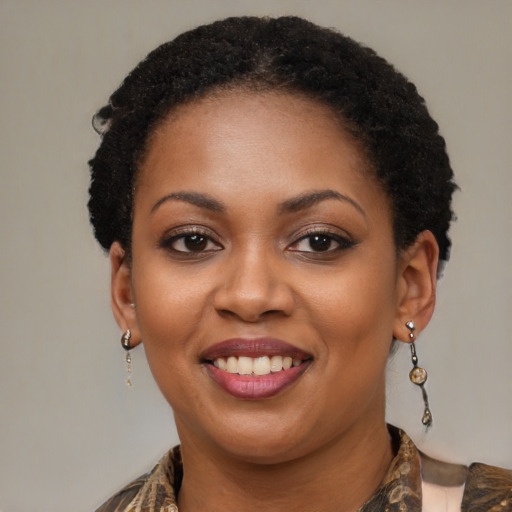 Joyful black young-adult female with medium  brown hair and brown eyes