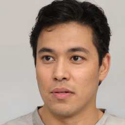 Neutral asian young-adult male with short  brown hair and brown eyes