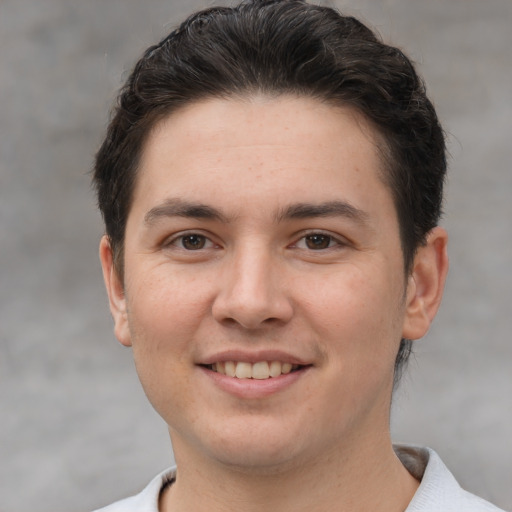 Joyful white young-adult male with short  brown hair and brown eyes