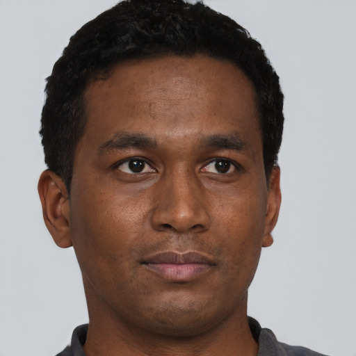 Neutral black young-adult male with short  brown hair and brown eyes