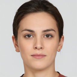 Neutral white young-adult female with short  brown hair and brown eyes