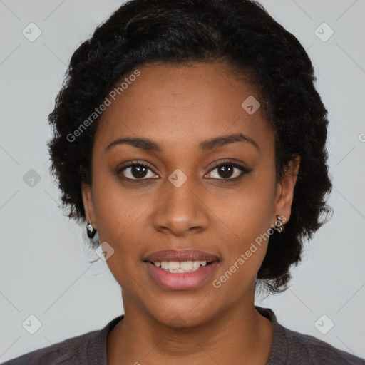 Joyful black young-adult female with medium  black hair and brown eyes