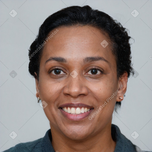 Joyful black adult female with short  black hair and brown eyes