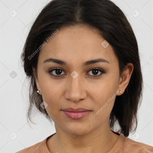 Joyful latino young-adult female with medium  brown hair and brown eyes