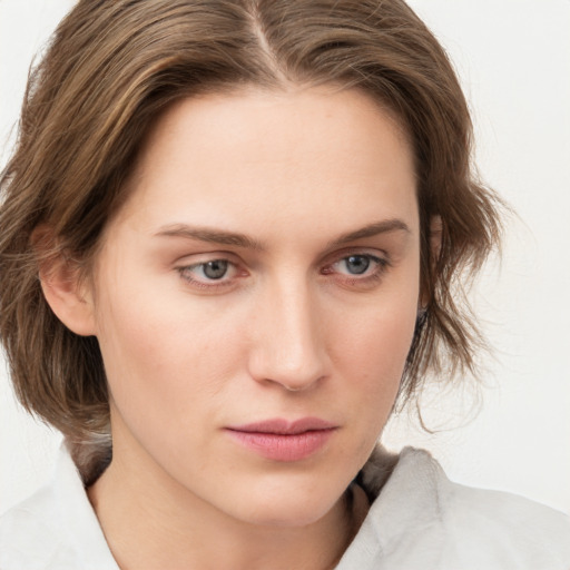 Neutral white young-adult female with medium  brown hair and blue eyes