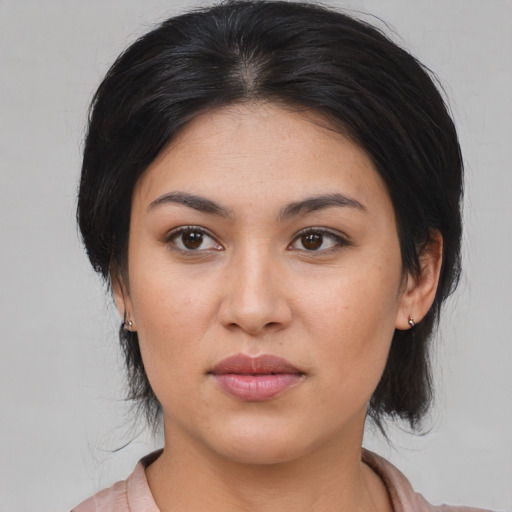 Joyful asian young-adult female with medium  brown hair and brown eyes