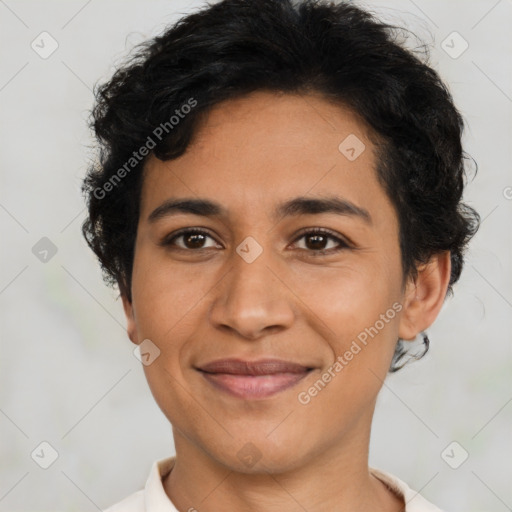 Joyful latino young-adult female with short  brown hair and brown eyes