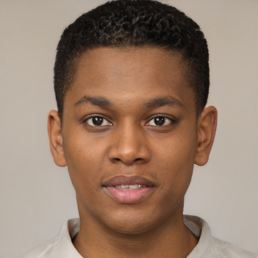 Joyful black young-adult male with short  brown hair and brown eyes