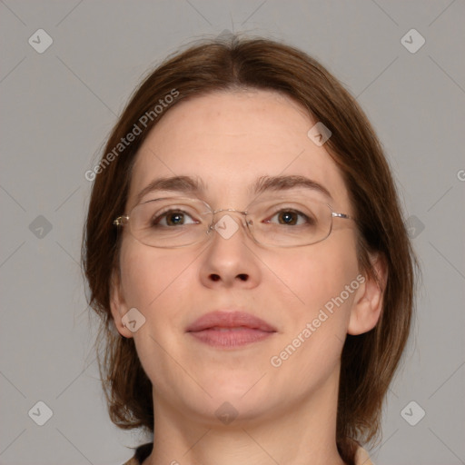 Joyful white adult female with medium  brown hair and green eyes