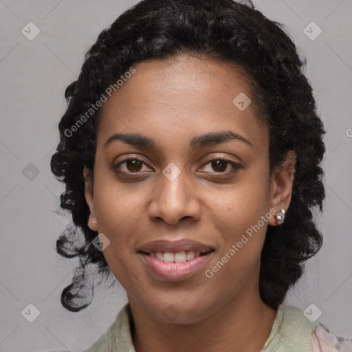 Joyful black young-adult female with long  black hair and brown eyes