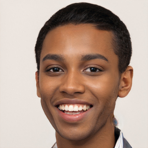 Joyful black young-adult male with short  black hair and brown eyes