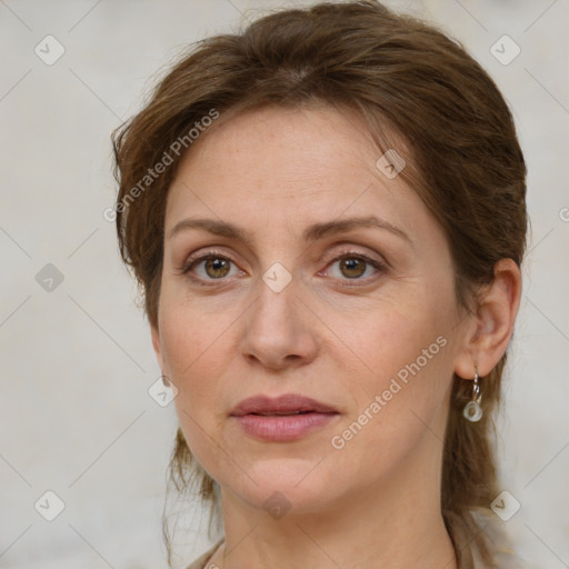 Joyful white adult female with medium  brown hair and grey eyes