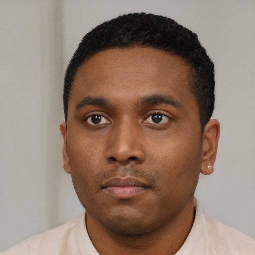 Neutral black young-adult male with short  black hair and brown eyes