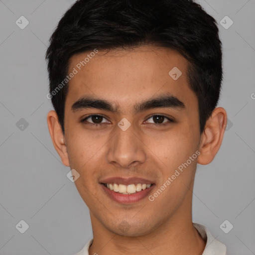 Joyful latino young-adult male with short  brown hair and brown eyes